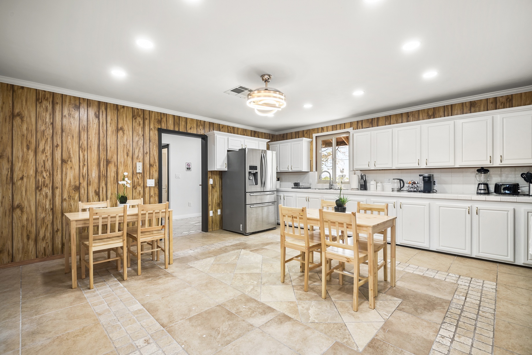 The eat-in kitchen and family tables at Hesperia Assisted Living — where meals and conversation happen